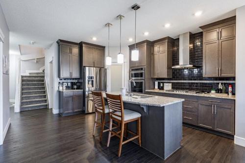 Southeast Edmonton House | Group Getaway with Yard, Sleeps 13, Near YEG Airpt