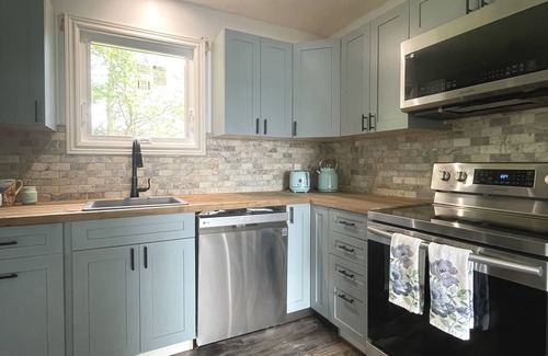 Stone Mills Cottage | Modern, Sunset-Facing Waterfront Cottage