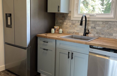 Stone Mills Cottage | Modern, Sunset-Facing Waterfront Cottage