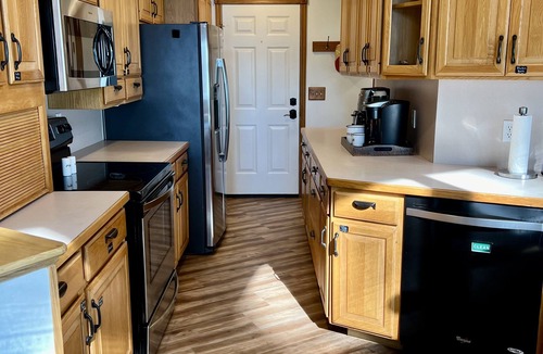 Cokato Cabin | A Creek Runs Through It & Garage Great Room