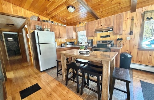 Allagash Cabin | Allagash Elevated Escape Cedar Hot Tub Outdoor Entertaining Riverfront