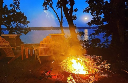 Litchfield House | Belle Haven has 3 separate wood decks, one stone patio, a dock, & a beach house.