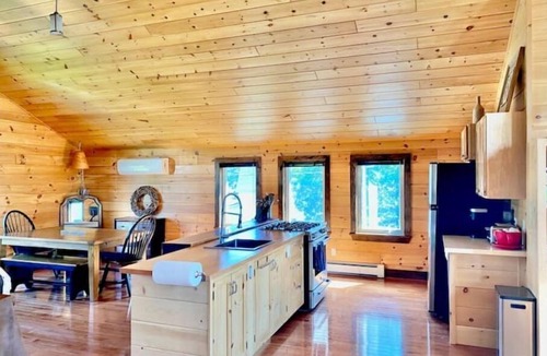 Britt Cottage | Cathedral pine cabin on the river, Open concept