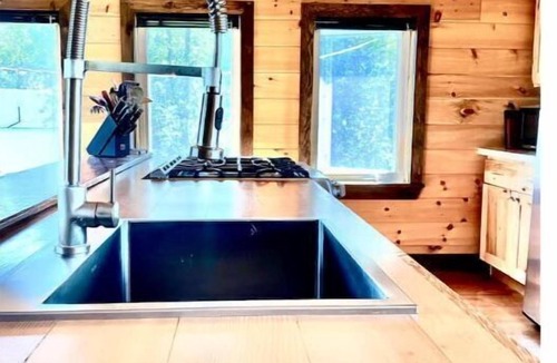 Britt Cottage | Cathedral pine cabin on the river, Open concept