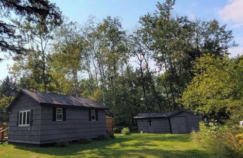 Kerrick Cabin | Charming cabin in delightful Duquette with AC near miles of ATV trails.