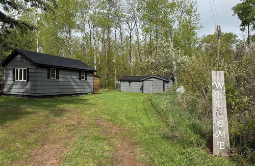 Kerrick Cabin | Charming cabin in delightful Duquette with AC near miles of ATV trails.
