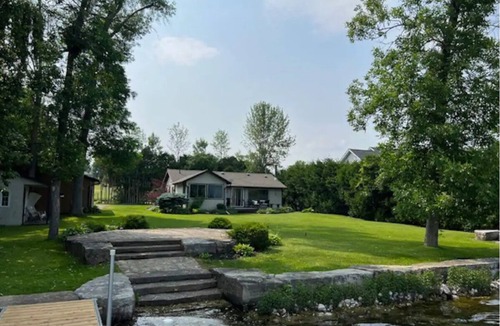 Ennismore House | Cozy Cottage remodelled with great private yard beach and dock! 3 Beds 1 Bath