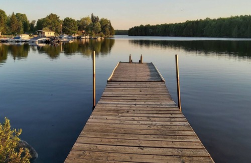 Magnetawan Cottage | cozy lakefront cottage with firepit and boat dock