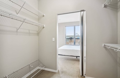 Mill District Apartment | CozySuites Mill District with pool, gym # 09