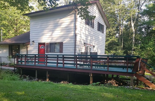 Balm Beach House | Creek Chalet at Balm Beach with Hot Tub & Sauna