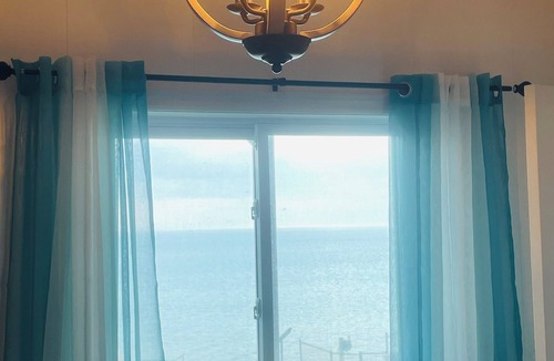 Selkirk Cottage | Embrace Lake Erie in our charming 2-story nautical waterfront cottage. n