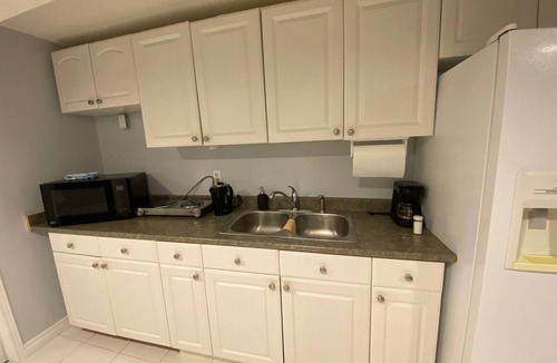 Lisgar Apartment | furnished basement studio, with1 queen bed, a kitchenette, and 1 bathroom. n