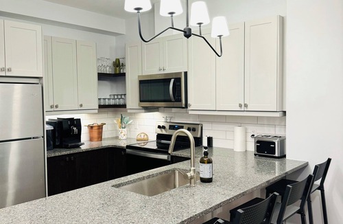 Grand Bend Apartment | Grand Bend Escape Central Luxury - Overlooking Main Street - Walk to Beach