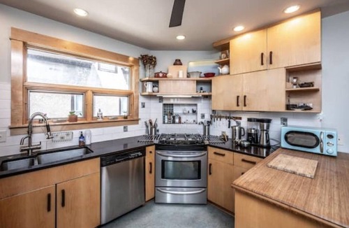 Holland House | Hygge Hideaway with gas fireplace, fenced yard, and eco friendly products