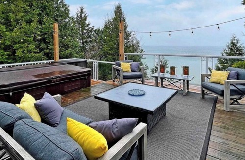 Brock House | Lakefront Cottage w/Hot Tub, BBQ Grill, Patio, Fire Pit, Dock, Sauna, Fire Place