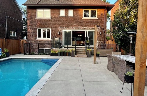 West Bend House | Large Family Home in High Park with Resort-like Backyard with Pool/Sauna
