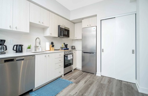Kitchener Apartment | Modern High-Rise 24th Floor Condo w Private Patio