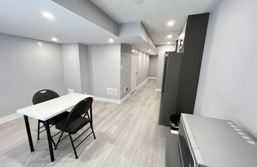 Meadowvale Village House | One bedroom ensuite toilet on main level & kitchen, living, bathroom lower level