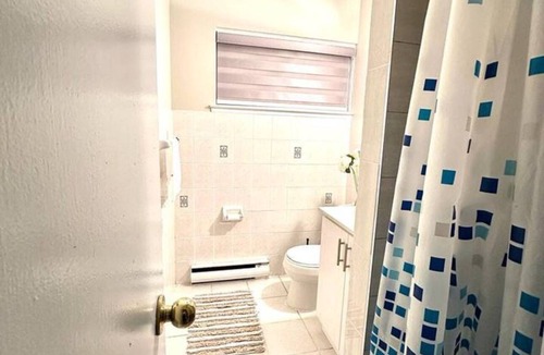 Mississauga Valleys House | Private home with large bedroom and spacious common areas with patio.