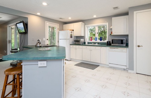 Webster House | Quaint Urban Cottage/Guest House on 3 acre wooded lot over looking a pond.