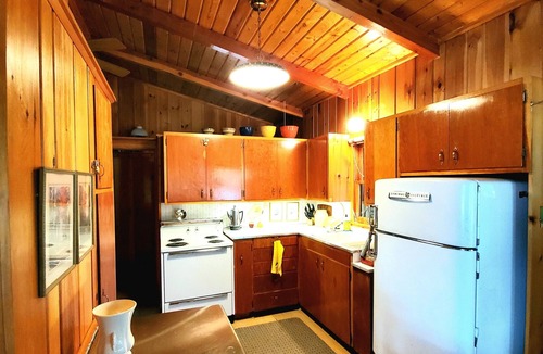 Bigfork Cabin | Rustic cabin in remote wooded area on point overlooking lake.