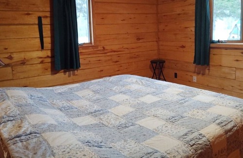 Finlayson House | Rustic Log Lodge Secluded acres with private lake & pond