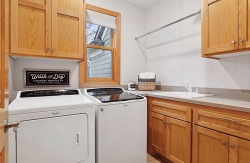 Hugo House | Serene Suburban Retreat with Hot Tub next to the Super Rink, 3M Open and USA Cup