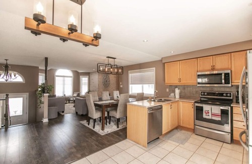 Barrie House | Serenity & Style: 4BR w/Hot Tub, BBQ & Fire Table