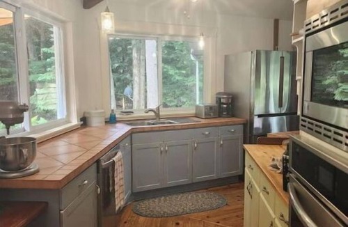 Haliburton House | Spacious, waterfront home surrounded by trees with large dock & games room.