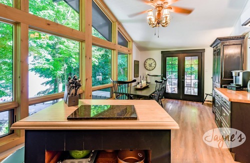 Seguin Cottage | Sunrises! Hot tub! Outdoor Kitchen! Spacious beach! Multiple outdoor fire pits!
