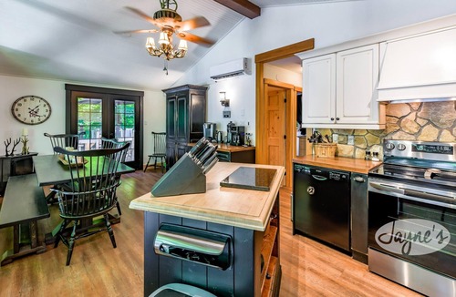 Seguin Cottage | Sunrises! Hot tub! Outdoor Kitchen! Spacious beach! Multiple outdoor fire pits!