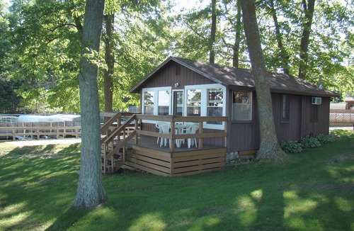 Walker Cabin | The Beach House Leech Lake - King bed &wall of windows just steps from the lake.