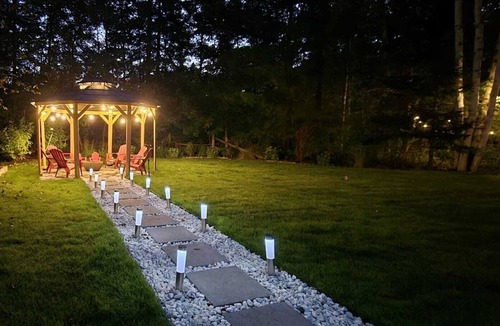 Lake St. Peter Cottage | The Wooded Oasis - Cozy Winter Cottage w/Hot Tub & Sunken Firepit