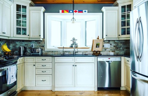 Perry House | Water Front Cottage on Lake Mirage, Private Dock, Sandy Beach and Hot Tub!