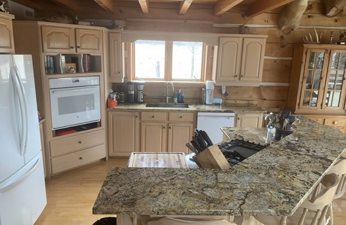 North Algona Wilberforce Cottage | Waterfront log home on Lake Dore. Decks, dock, outdoor hot tub and fire pit.
