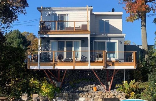 Geneva House | Waters Edge Lakefront with Kayaks Fire Pit and Dock