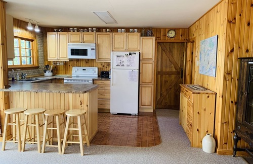 Trent Lakes Cottage | Yellow Cottage Sandy Lake Buckhorn. Beautiful turquoise water, water equipment.