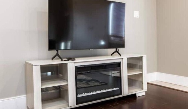 Beautiful walkout basement suite with floor to ceiling windows and a great view