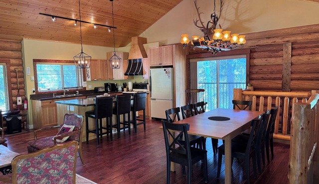 Experience the warmth of our gorgeous log home backing onto the first fairway.