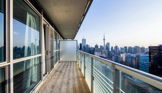 High-Floor 2BR Suite Balcony & Skyline Views | Walk to SickKids, UHN, TMU, Eaton