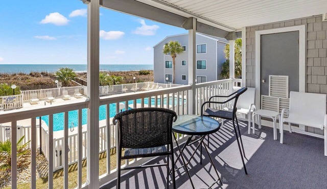 Oceanfront escape with pool & balcony views — peaceful 2BR retreat near Main Street & Cherry Grove