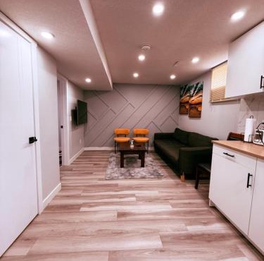 Spacious 2 bedroom with 2 queen beds and one sofa bed lower unit with separate entrance and parking space Near Downtown, Calgary Zoo, Costco and many more