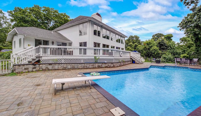 Sprawling sun-lit home with private heated pool, arcade, air hockey, & grill
